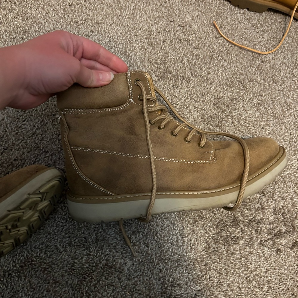 Cliff by white mountain boots